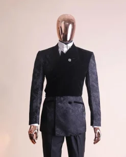 A charcoal black “equalizer” quadruple breasted, knitted, layered peak lapel with velvet overlay-ed tuxedo jacquard suit