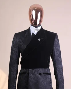 A charcoal black “equalizer” quadruple breasted, knitted, peak lapel with velvet tuxedo jacquard suit
