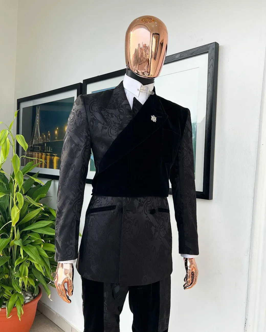 A charcoal black “equalizer” quadruple breasted, knitted, peak lapel with velvet tuxedo jacquard suit
