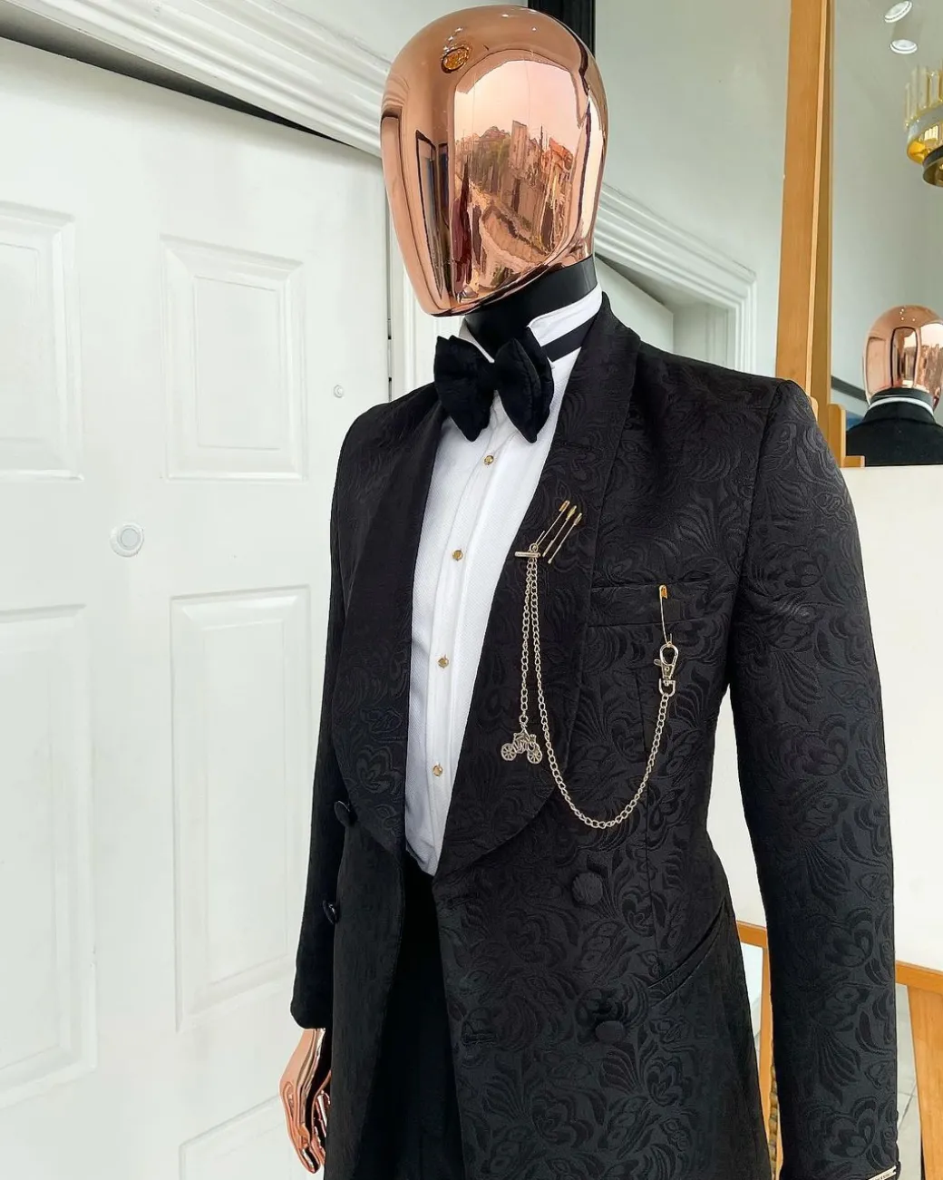 A Charcoal black, floral pattern, double-breasted shawl lapel jacquard tuxedo suit.