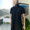 A Charcoal black, front flap, roaring tiger patch design and Swarovski button details african traditional senator kaftan native.