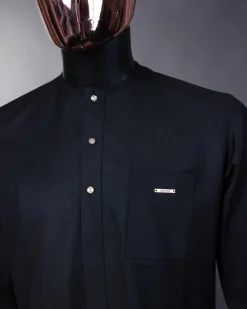 A charcoal black front flap with gold Swarovski buttons, patch pocket, and 3/4 sleeve details African senator kaftan native
