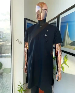 A Charcoal black, front flap, roaring tiger patch design and Swarovski button details african traditional senator kaftan native.