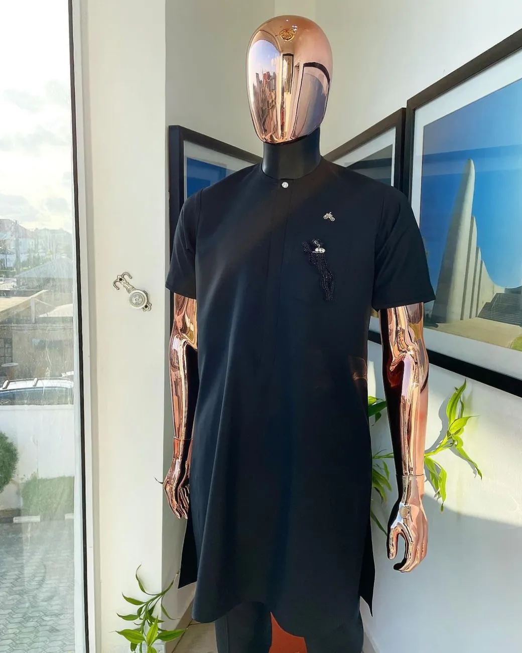A Charcoal black, front flap, roaring tiger patch design and Swarovski button details african traditional senator kaftan native.
