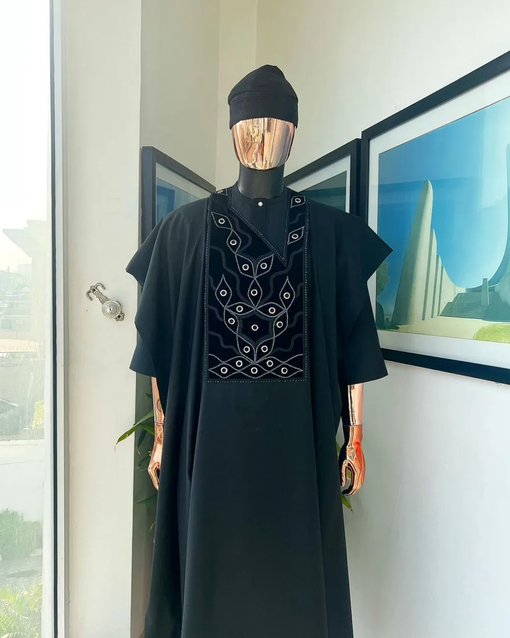 A charcoal black, grommet eyelet on root splash embroidery details agbada