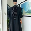A charcoal black, grommet eyelet on dropping octa with silver Swarovski embroidery details agbada