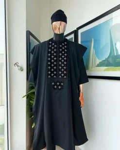 A charcoal black, grommet eyelet on dropping octa with silver Swarovski embroidery details agbada