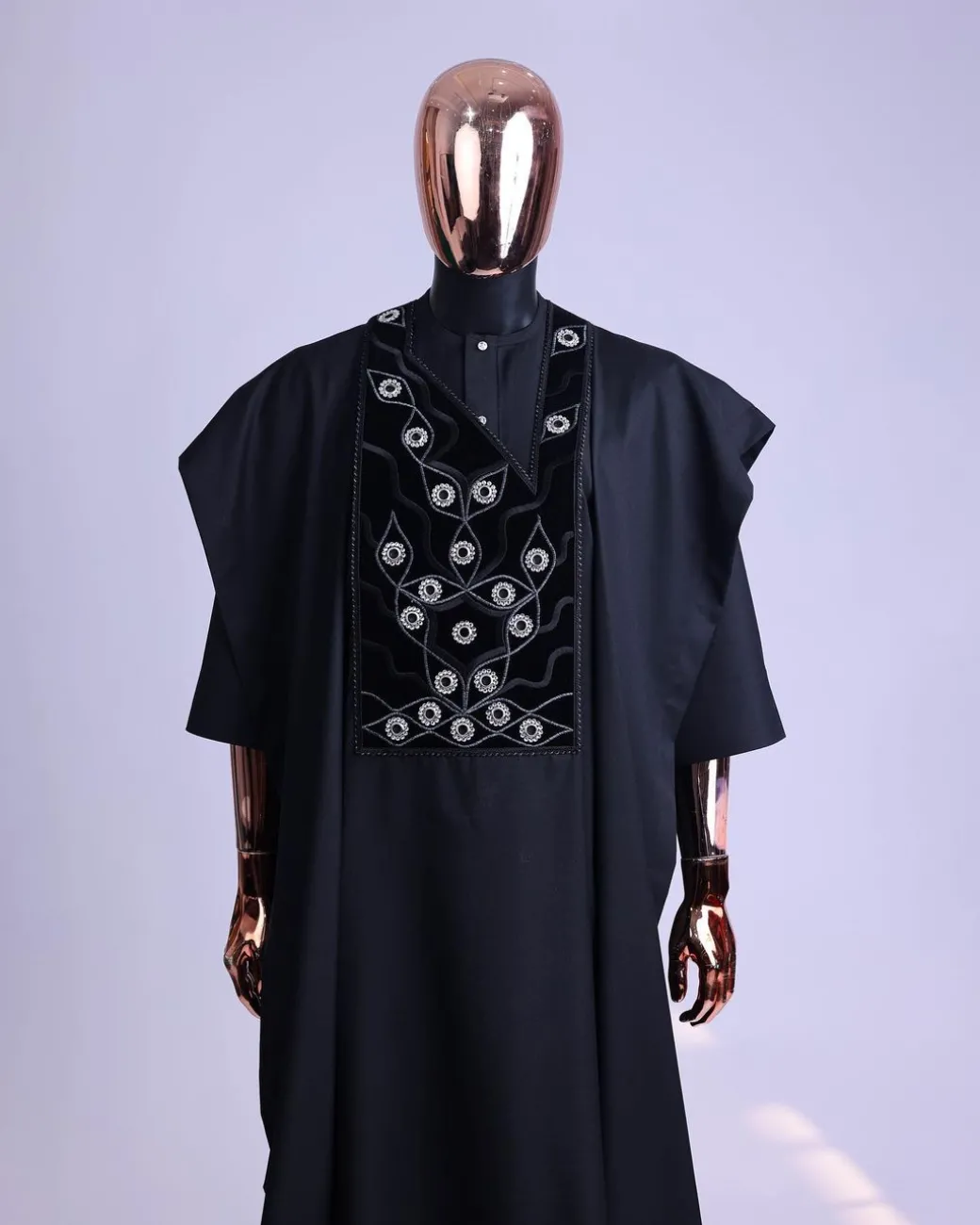 A charcoal black, grommet eyelet on root splash embroidery details agbada