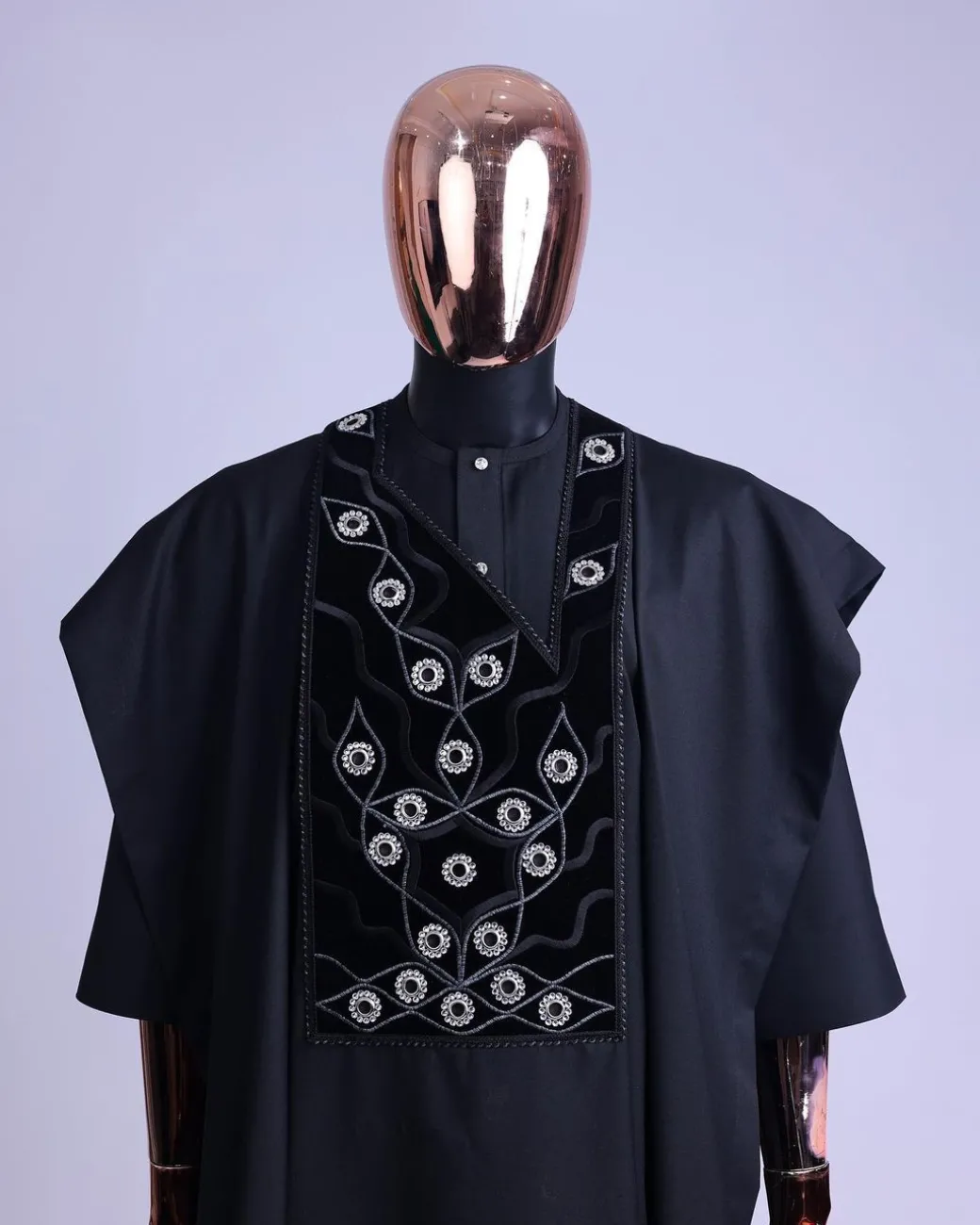 A charcoal black, grommet eyelet on root splash embroidery details agbada