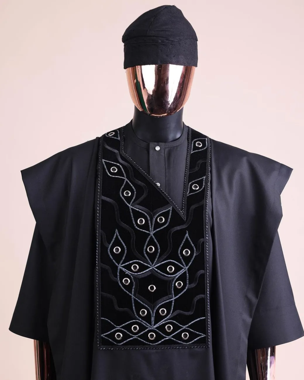 A charcoal black, grommet eyelet on root splash embroidery details agbada