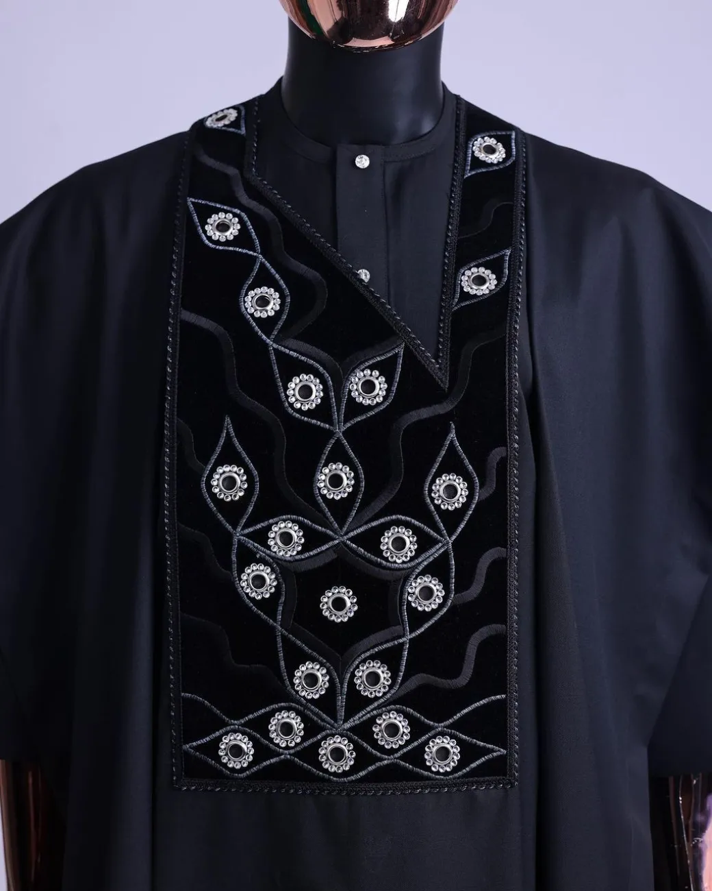 A charcoal black, grommet eyelet on root splash embroidery details agbada