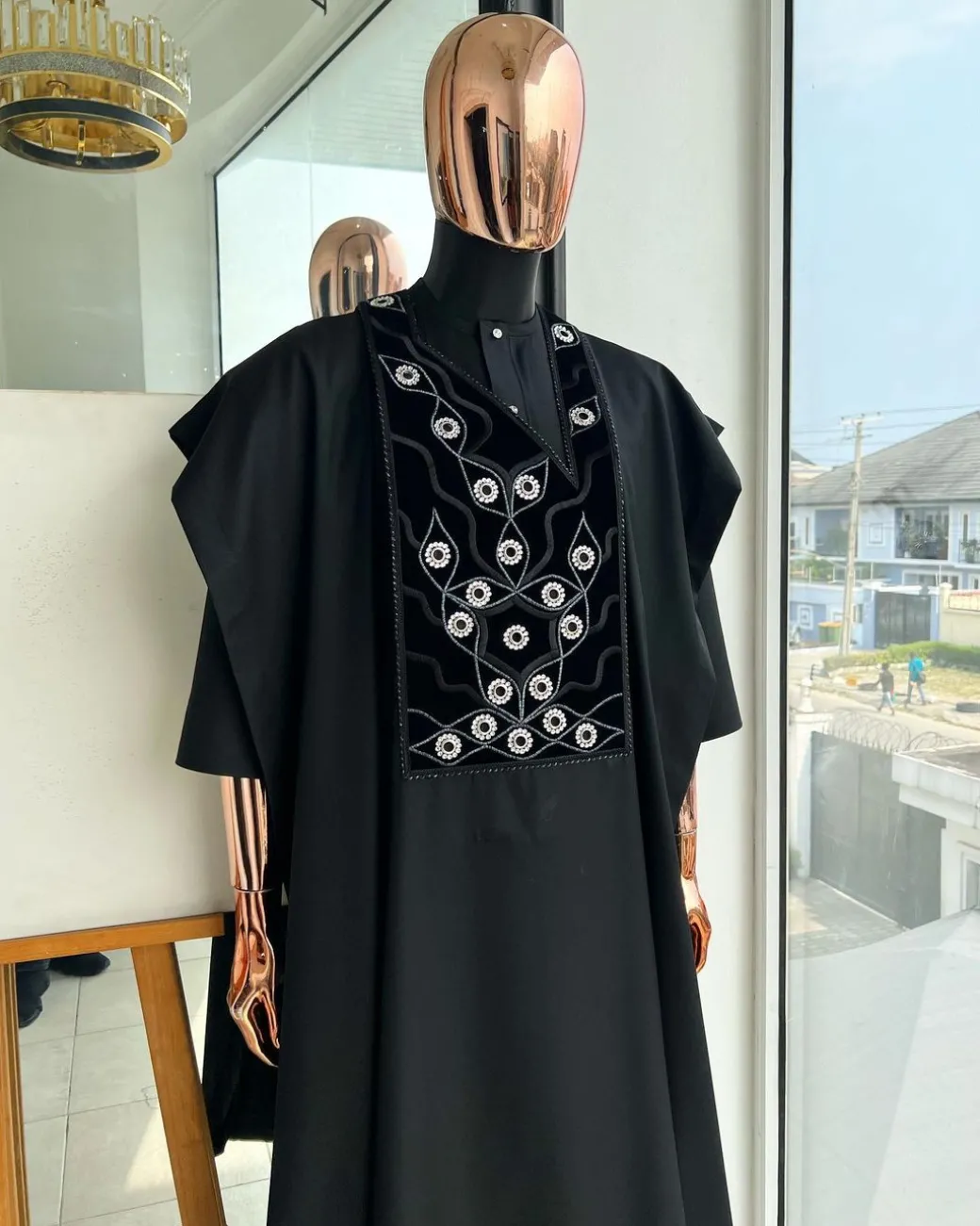 A charcoal black, grommet eyelet on root splash embroidery details agbada