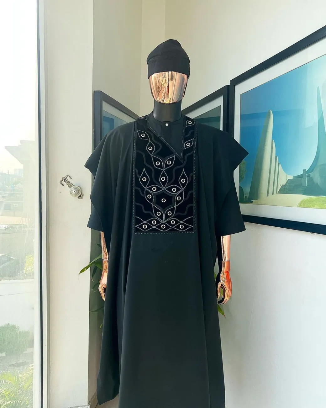 A charcoal black, grommet eyelet on root splash embroidery details agbada