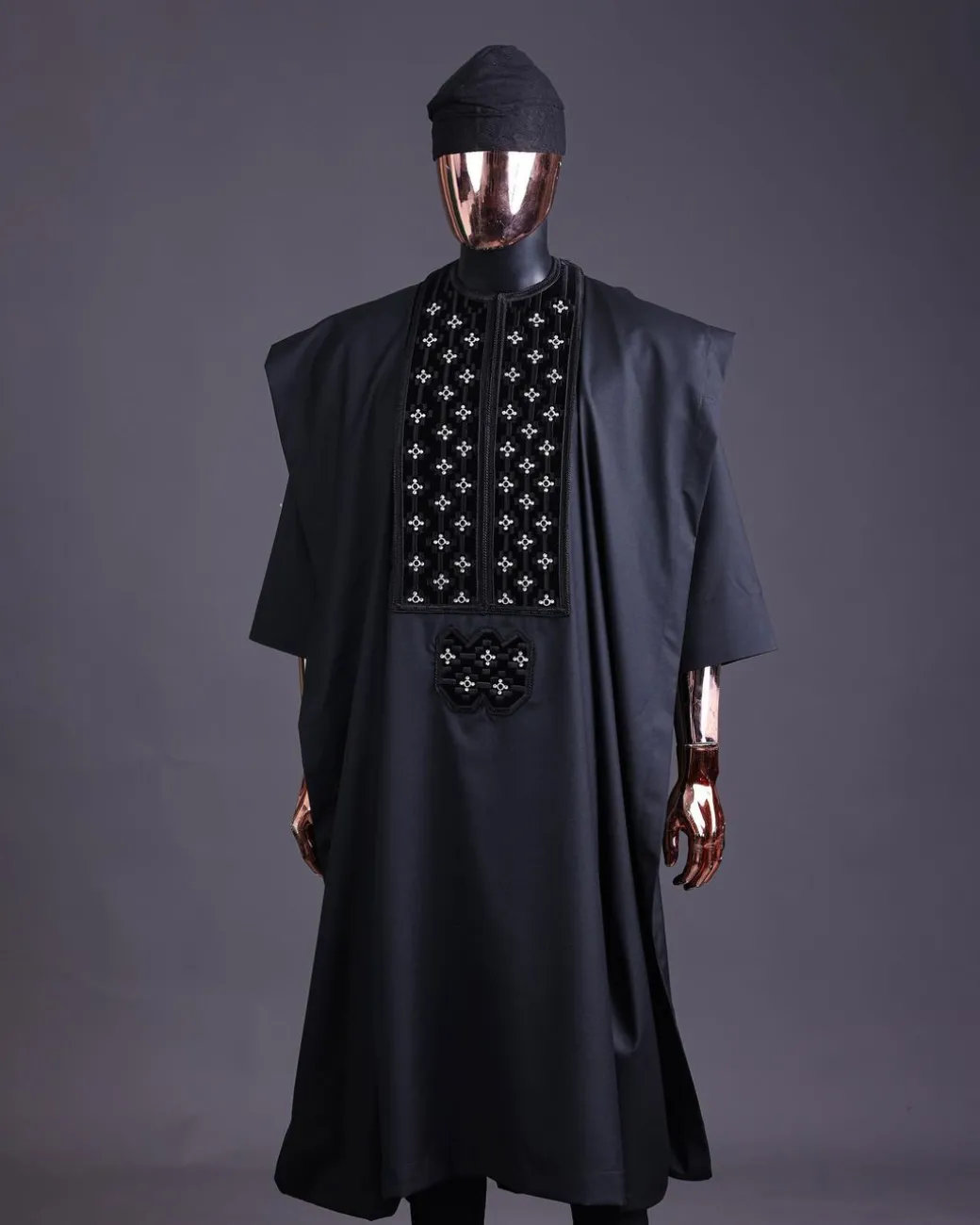 A charcoal black, grommet eyelet on dropping octa with silver Swarovski embroidery details agbada