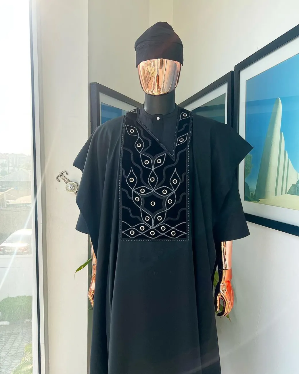 A charcoal black, grommet eyelet on root splash embroidery details agbada