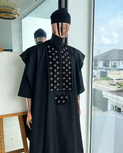 A charcoal black, grommet eyelet on dropping octa with silver Swarovski embroidery details agbada