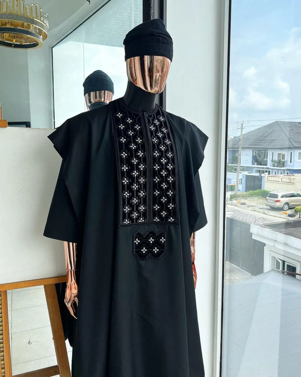 A charcoal black, grommet eyelet on dropping octa with silver Swarovski embroidery details agbada