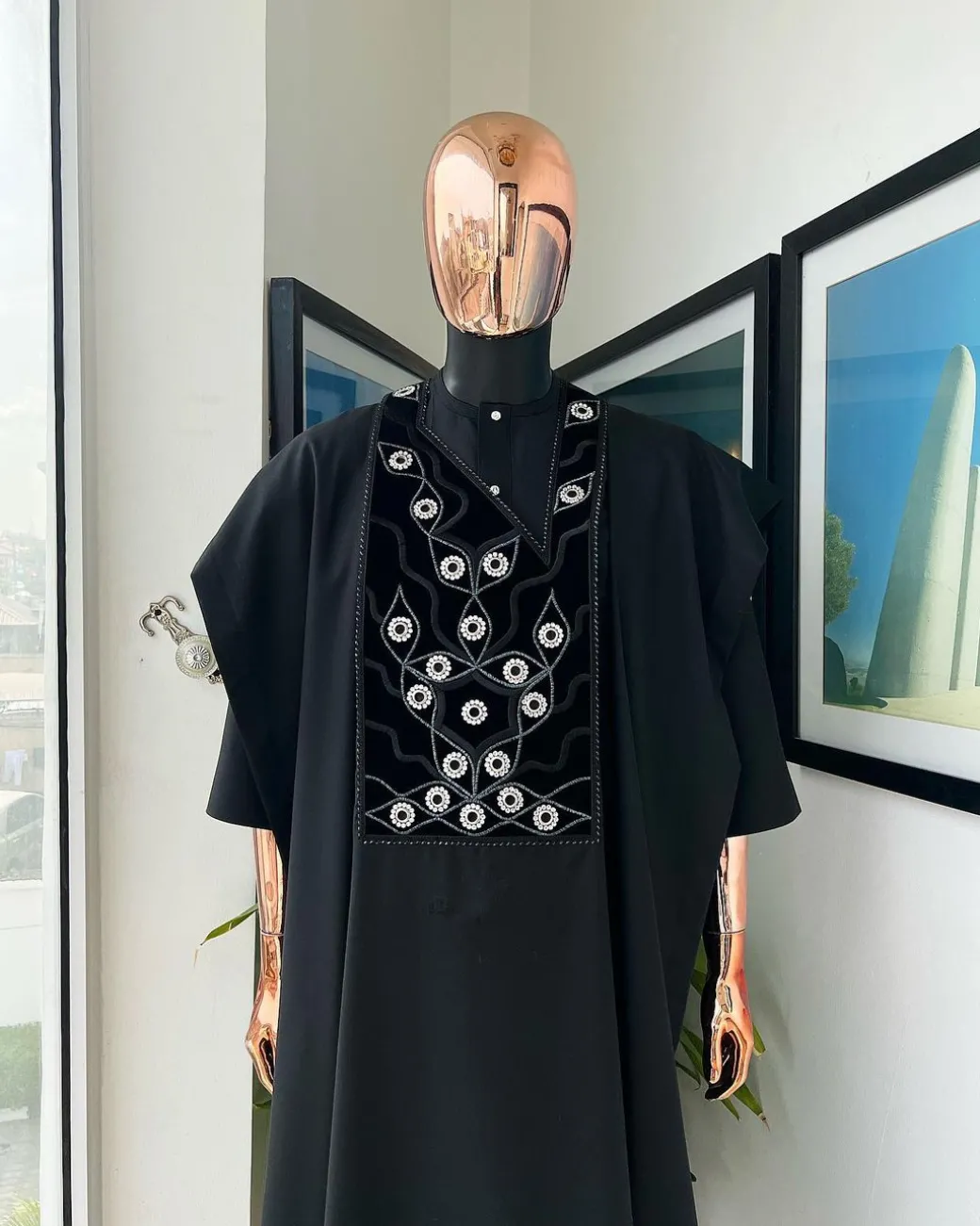 A charcoal black, grommet eyelet on root splash embroidery details agbada