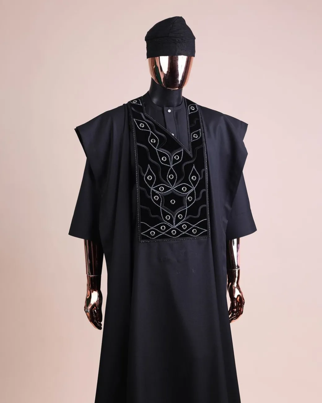 A charcoal black, grommet eyelet on root splash embroidery details agbada