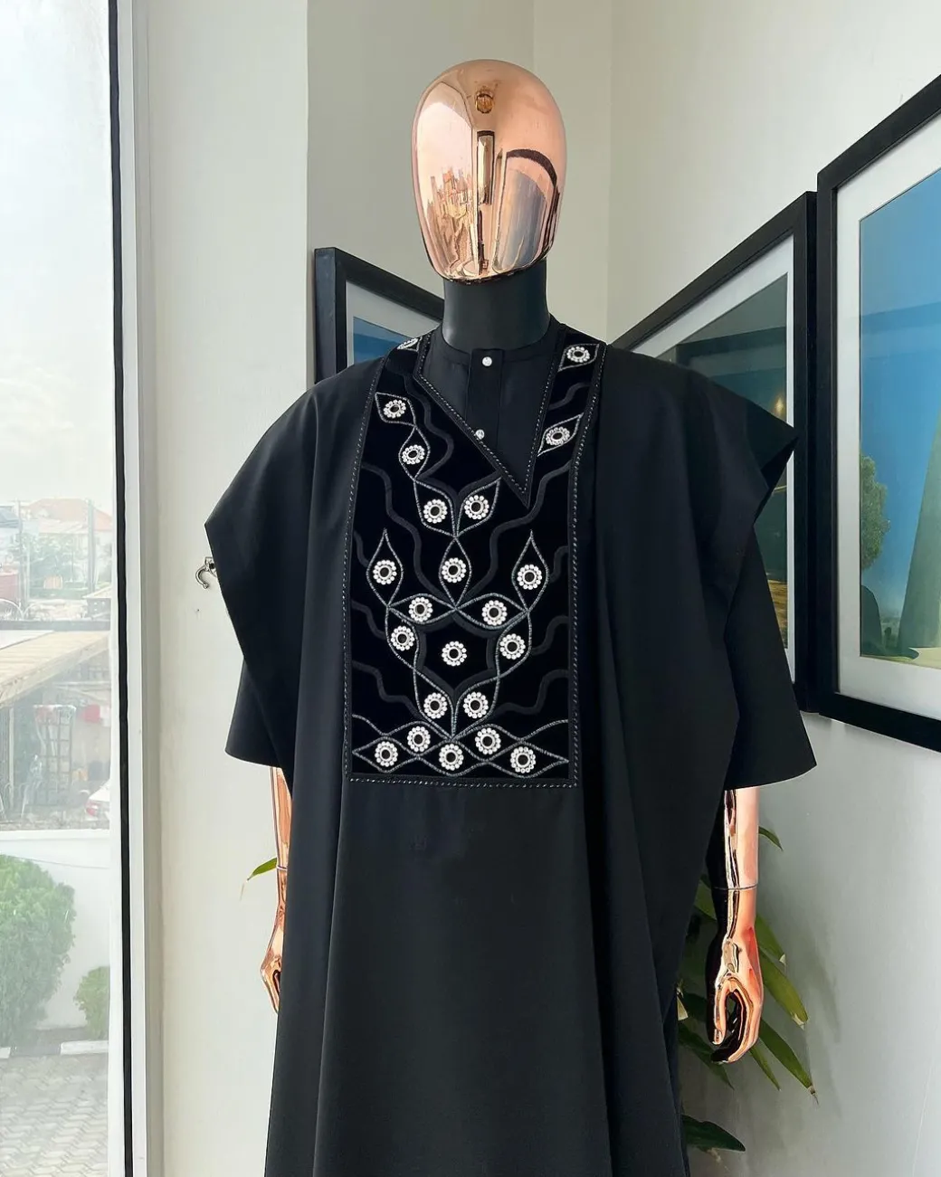 A charcoal black, grommet eyelet on root splash embroidery details agbada
