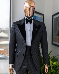 A Charcoal black inverted square patterned metallic jacquard tuxedo with charcoal black velvet peak lapel suit
