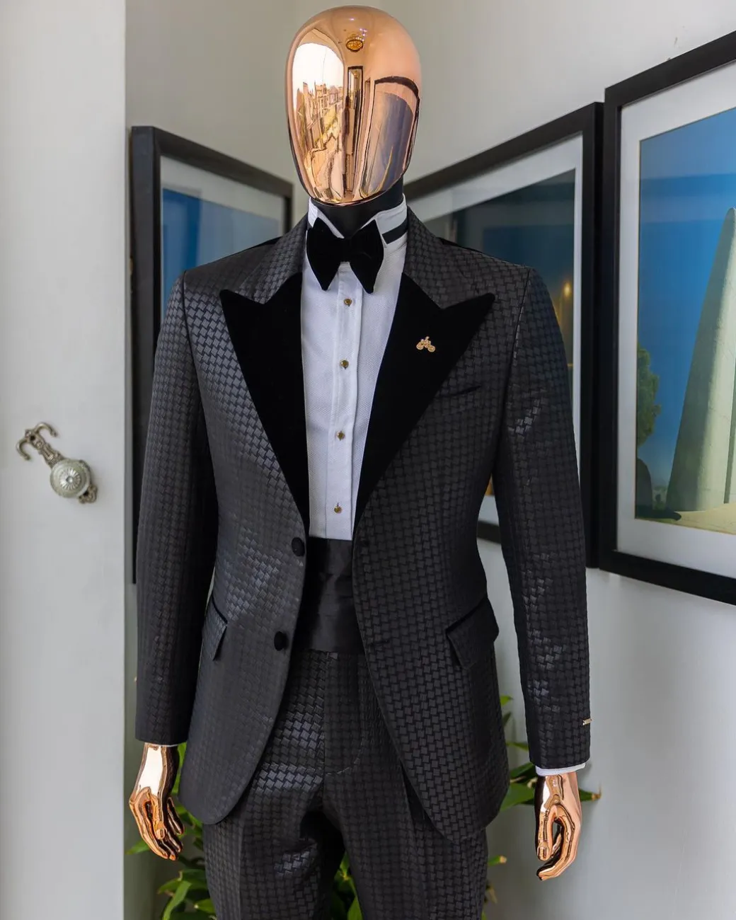 A Charcoal black inverted square patterned metallic jacquard tuxedo with charcoal black velvet peak lapel suit