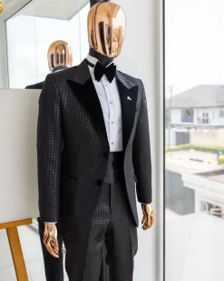 A Charcoal black inverted square patterned metallic jacquard tuxedo with charcoal black velvet peak lapel suit