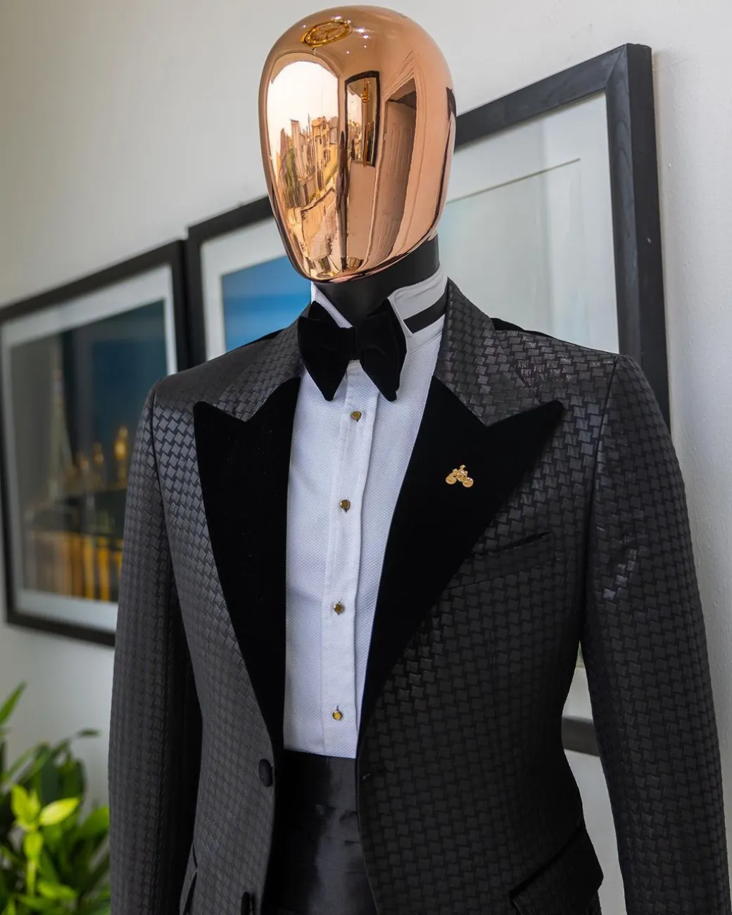 A Charcoal black inverted square patterned metallic jacquard tuxedo with charcoal black velvet peak lapel suit