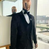A Charcoal black, mandarin floral pattern with gold detailing metallic Jacquard velvet peak lapel tuxedo suit