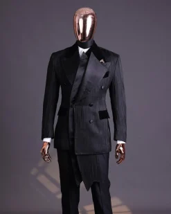 A Charcoal Black “Mandate” rain drop patterned jacquard, triple breasted, 2 layer dropping sache tuxedo suit.