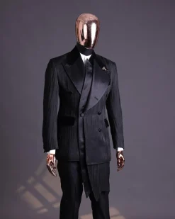 A Charcoal Black “Mandate” rain drop patterned jacquard, triple breasted, 2 layer dropping sache tuxedo suit.