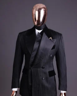 A Charcoal Black “Mandate” rain drop patterned jacquard, triple breasted, 2 layer dropping sache tuxedo suit.