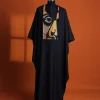 A Charcoal black, “Oju Aye” on canvas gold and black mix embroidery details Agbada