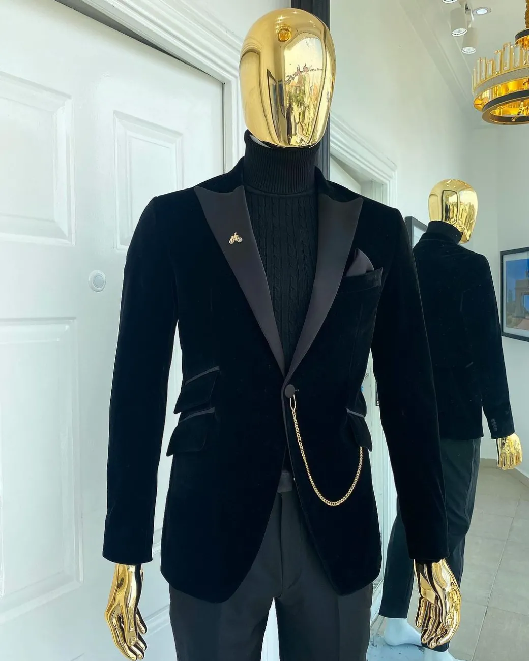A charcoal black peak lapel soaked Italian velvet tuxedo suit