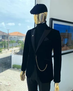 A charcoal black peak lapel-soaked Italian velvet tuxedo suit