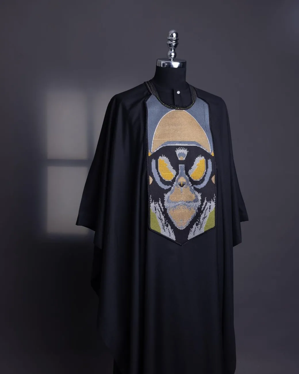 A charcoal black, “Planet Of Apes” embroidery Agbada