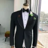 A Charcoal Black Shawl Lapel Tuxedo Suit.