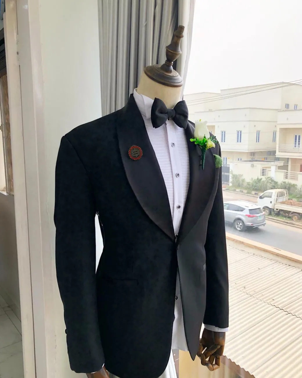 A Charcoal Black Shawl Lapel Tuxedo Suit.