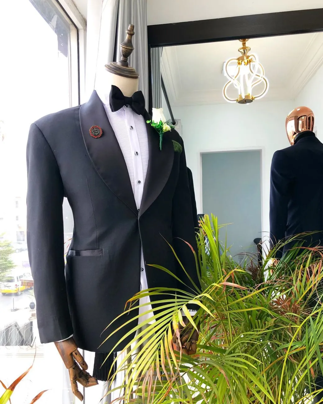 A Charcoal Black Shawl Lapel Tuxedo Suit.