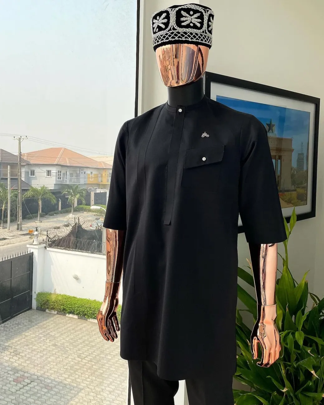 A Charcoal black, slanting combat pocket, front flap with clear view swarovski button detailing african traditional senator kaftan native.