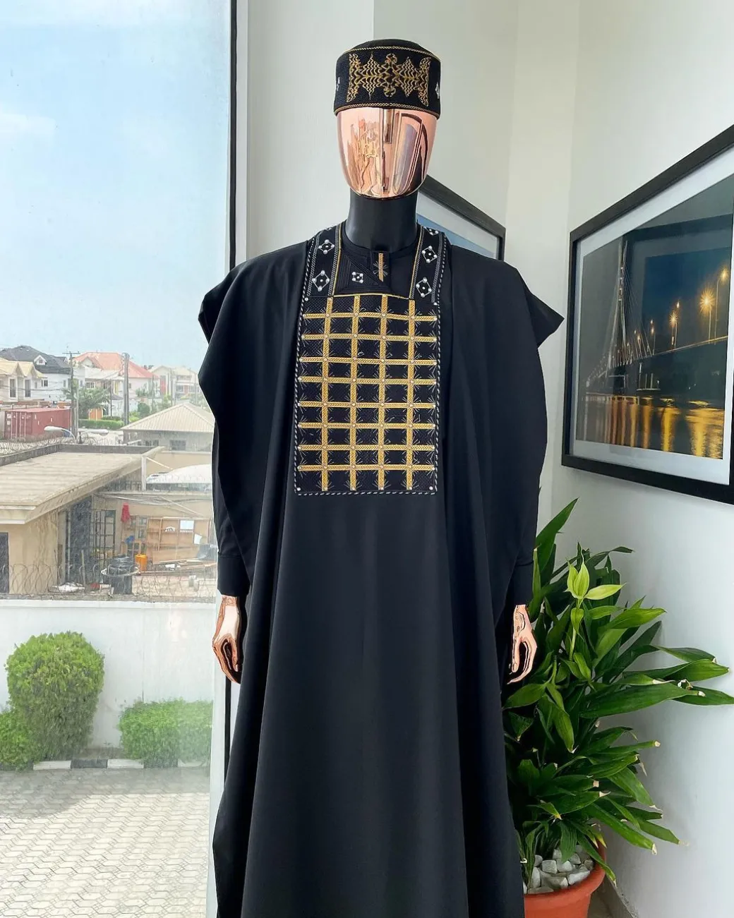 A charcoal black startled connected rectangle, with ss30 light topaz Swarovski crystal detailing agbada