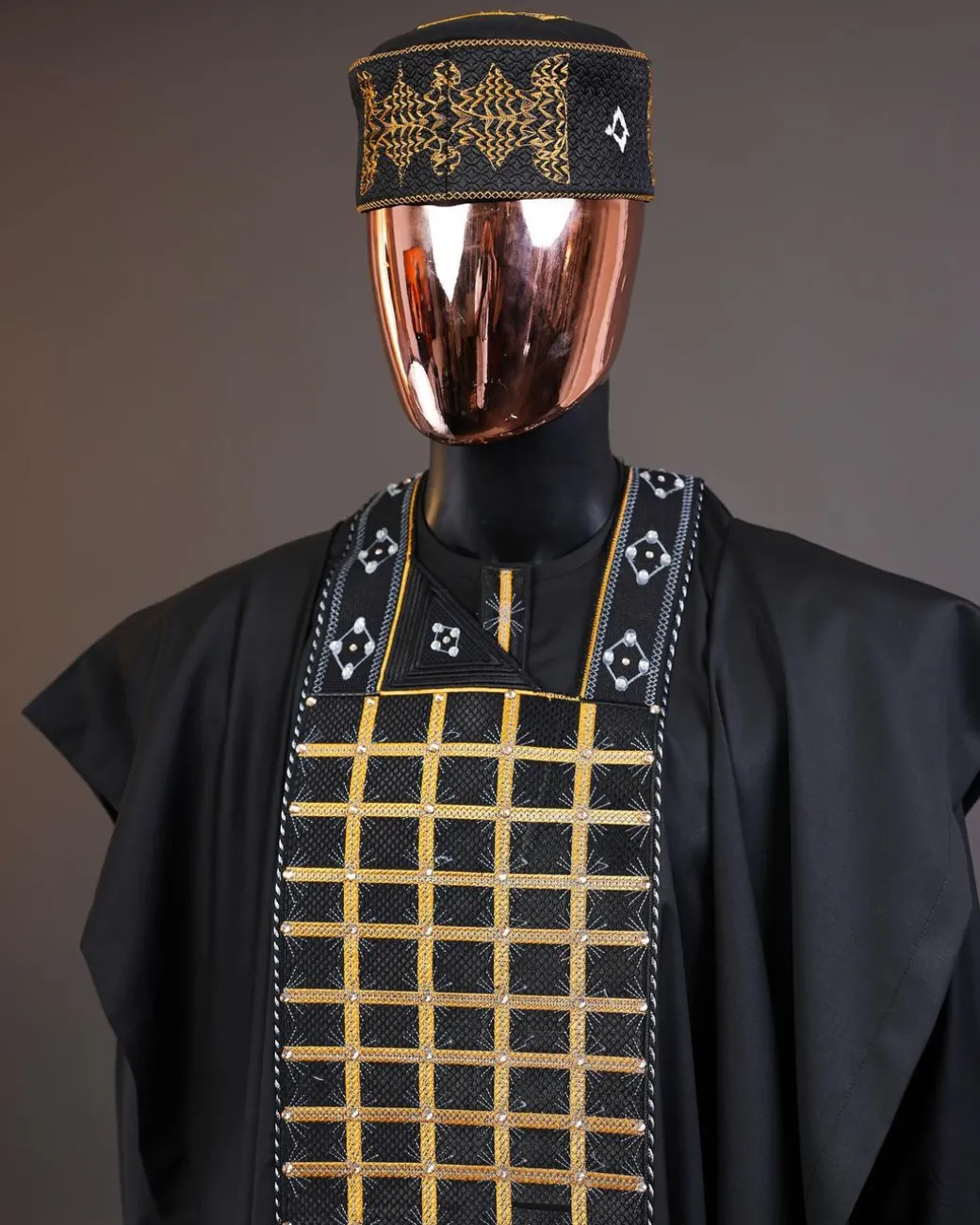 A charcoal black startled connected rectangle, with ss30 light topaz Swarovski crystal detailing agbada