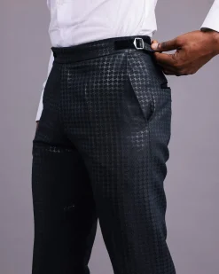 A Charcoal Black, Stuffed/Slanted Square-Patterned Jacquard pant with zip-line detailing