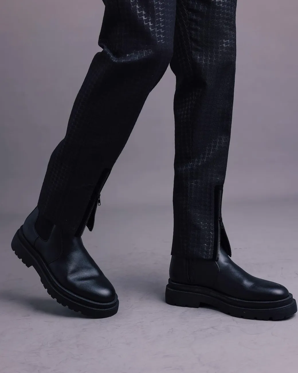 A Charcoal Black, Stuffed/Slanted Square-Patterned Jacquard pant with zip-line detailing