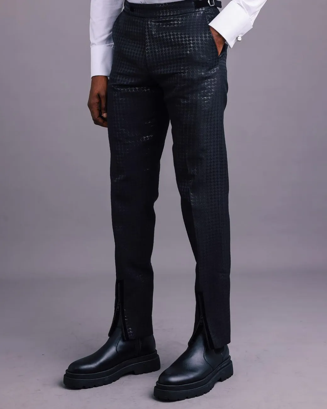 A Charcoal Black, Stuffed/Slanted Square-Patterned Jacquard pant with zip-line detailing