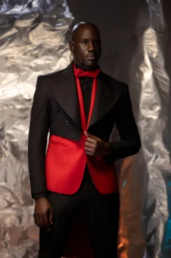 A Charcoal Black Tail Tuxedo Peal Lapel Tuxedo Suit and red Armless One Button Jacket