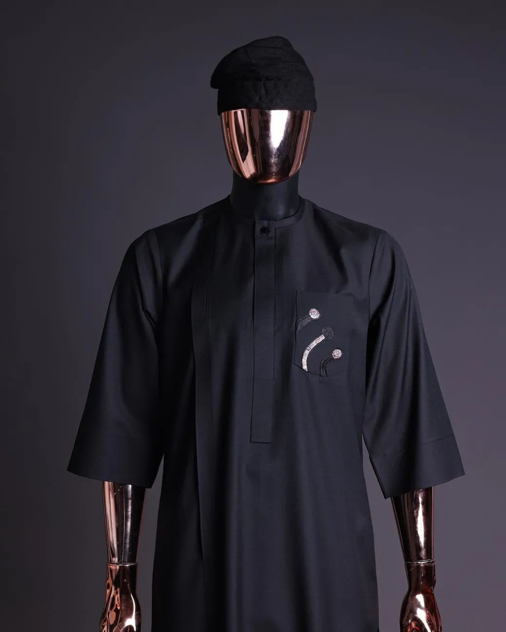 A charcoal black, thrown javelin embrodery details, 3/4 sleeve African senator kaftan native.