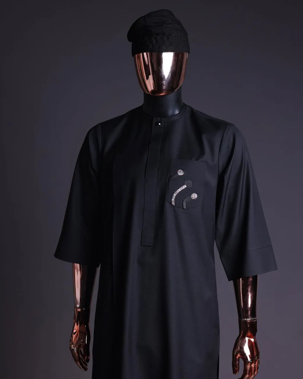 A charcoal black, thrown javelin embrodery details, 3/4 sleeve African senator kaftan native.