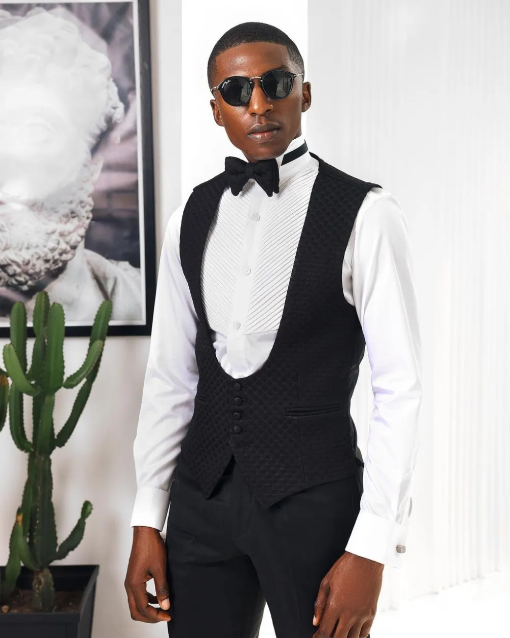 A Charcoal Black U-Cut waist coat with layered back cut.