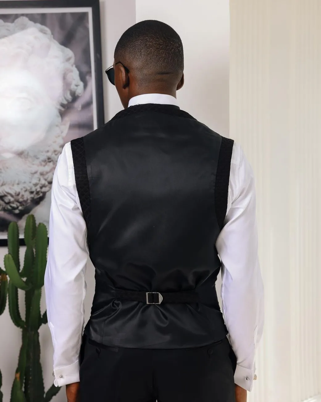 A Charcoal Black U-Cut waist coat with layered back cut.